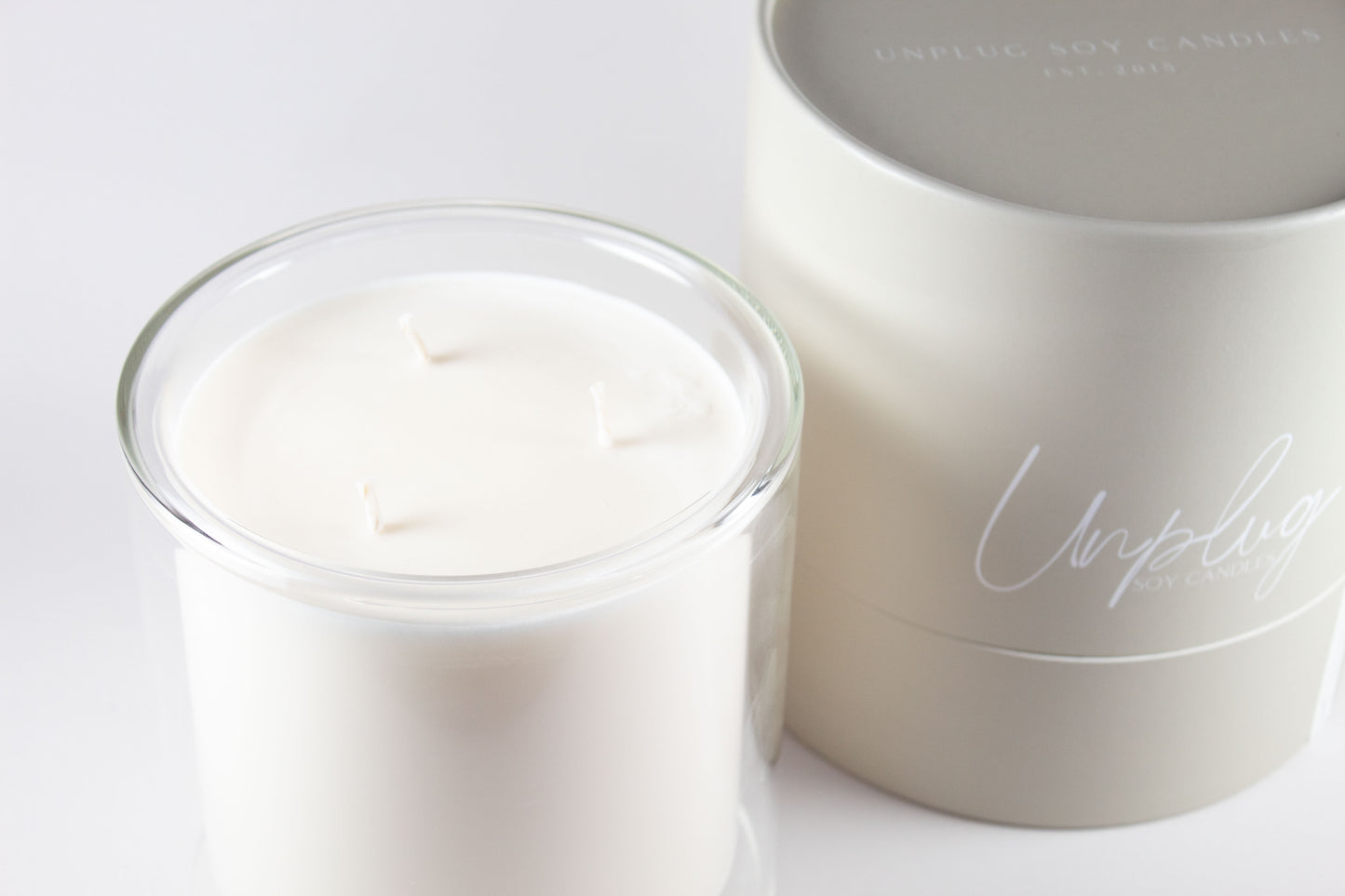 Close-up of Unplug Mysa Grand candle label on signature vessel