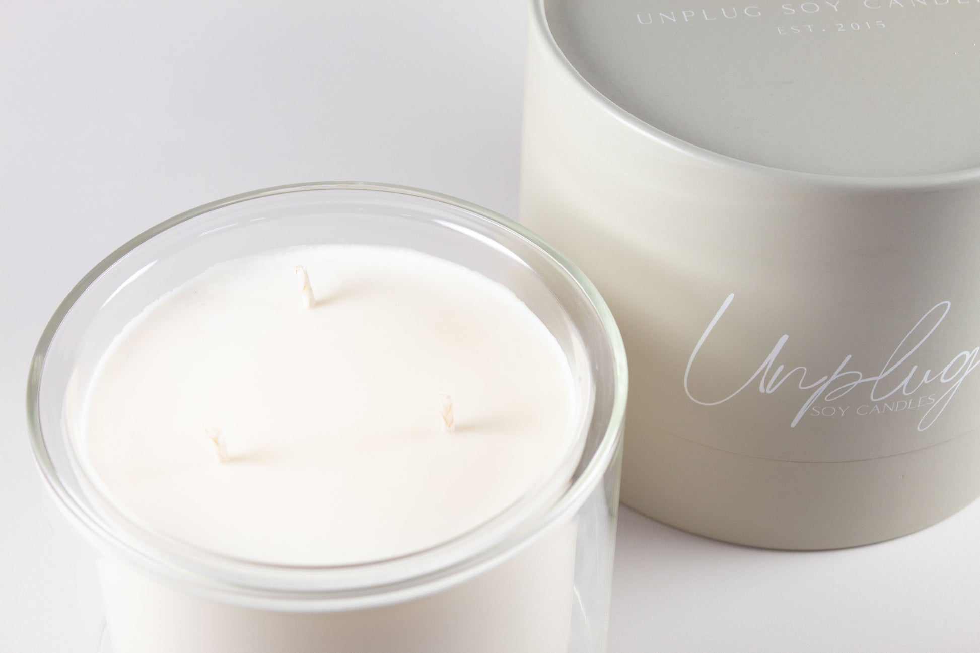 Close-up of Unplug Mysa Lagom candle label on minimalist jar