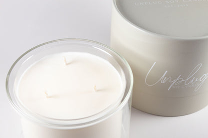 Close-up of Unplug Mysa Lagom candle label on minimalist jar