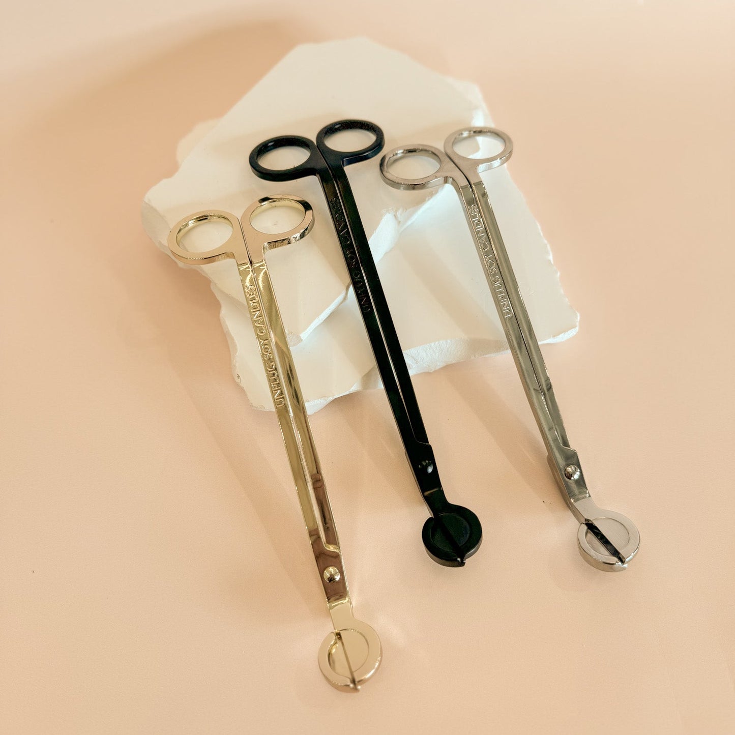 Angled view of Unplug wick trimmer – candle wick cutting tool
